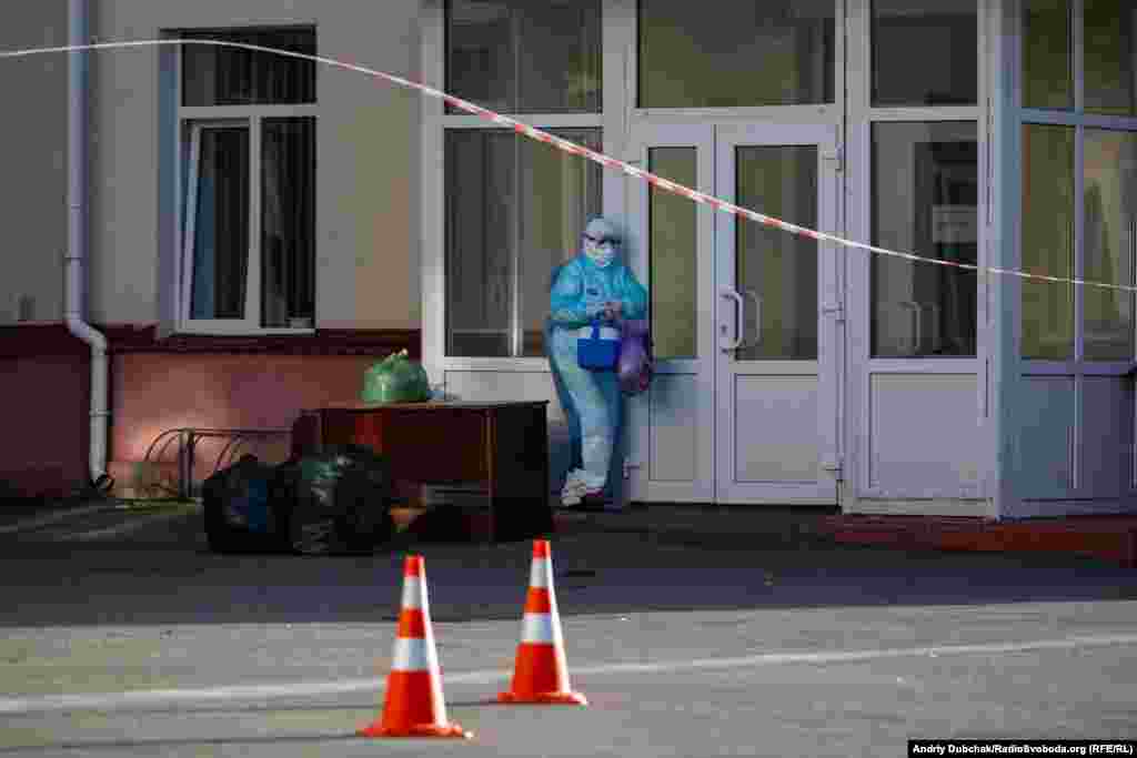 A medical worker collects supplies dropped off at Kalynivka&rsquo;s hospital. The facility is now effectively sealed off from the outside world. Waste is picked up and supplies are dropped off by people who avoid direct contact with the staff inside. &nbsp;