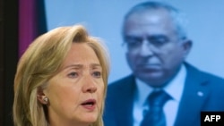 U.S. Secretary of State Hillary Clinton speaks alongside Palestinian Prime Minister Salam Fayyad in Washington.