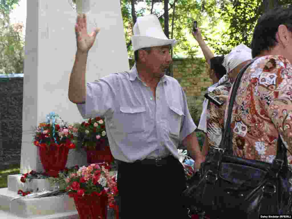 A Kyrgyz man shouts in anger following the commemoration. The man lost his son in the clashes, and says he blames the country’s president, Roza Otunbaeva, for failing to comprehend the depth of the suffering in Osh.Photo by RFE/RL's Daisy Sindelar 