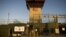 The front gate of "Camp Six" detention facility of the Joint Detention Group at the U.S. Naval Station in Guantanamo Bay in January 2012