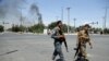 AFGHANISTAN -- Security forces soldiers arrive at the site of an explosion in Kabul, Afghanistan, Monday, July 1, 2019