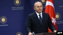 Turkey -- Turkish Foreign Affairs Minister Mevlut Cavusoglu (R) at a press conference in Ankara, December 9, 2014.