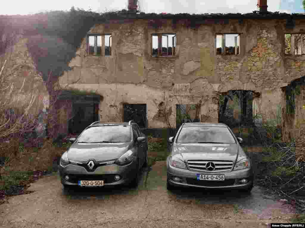 Cars parked in front of a ruined building near a popular cafe in Mostar&rsquo;s city center.