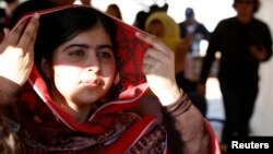 Pakistani teenage activist Malala Yousafzai leaves after speaking at a news conference at the Zaatri refugee camp, in the Jordanian city of Mafraq, near the border with Syria, in February.