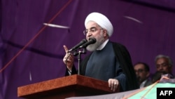 Iranian President Hassan Rohani addresses a campaign rally in the northeastern city of Mashhad on May 17.