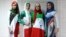 Iranian models presenting outfits bearing the national flag's colors, the logo of the national football team and the design of the 2014 World Cup during a fashion show organized by the House of Fashion and the "Violet Models" agency in Tehran.