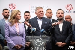 Fico (center) addresses a press conference in Bratislava on October 1.