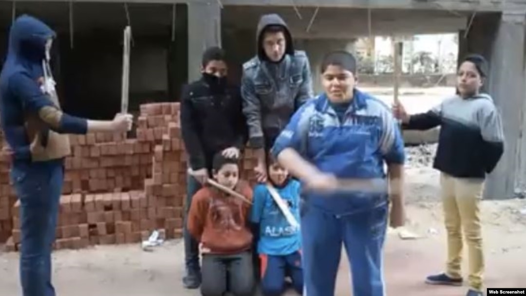 A screen grab from the video of Egyptian children carrying out a mock "execution." The video has circulated widely on social media.