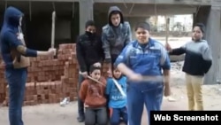 A screen grab from the video of Egyptian children carrying out a mock "execution." The video has circulated widely on social media.