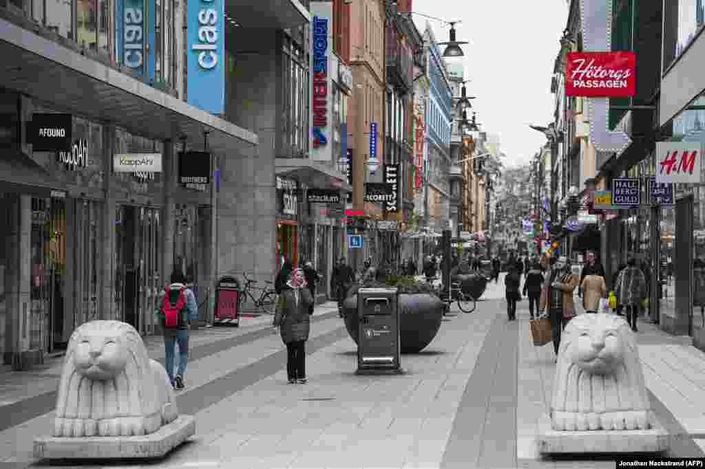 Sweden -- People walk in Drottninggatan in Stockholm, Sweden