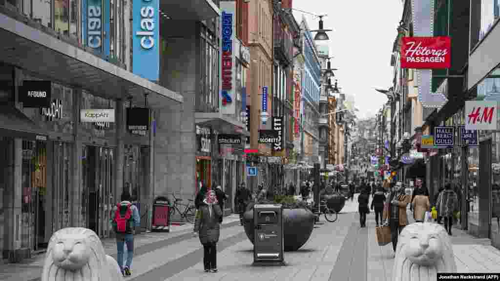 Sweden -- People walk in Drottninggatan in Stockholm, Sweden