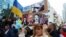 ISRAEL – A woman holds a sign at a rally in support of Ukraine, after Russia launched a massive military operation against Ukraine, on Rothschild Boulevard in Tel Aviv, Israel, February 26, 2022