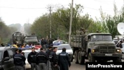 Georgian troops liberate the military base where a tank battalion apparently mutinied in the village of Mukhrovani, outside Tbilisi in May.