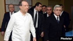 Armenia - President Serzh Sarkisian (R) visits the Surb Grigor Lusavorich hospital in Yerevan where one of his election challengers, Paruyr Hayrikian, is recovering from a gunshot wound, 1Feb2013. 