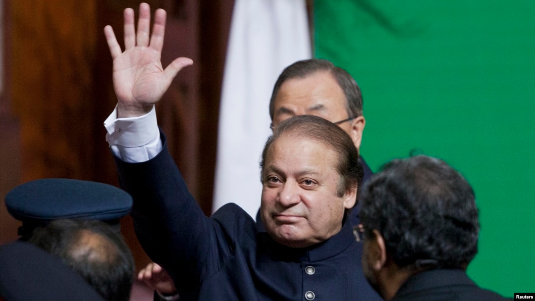 Pakistani Prime Minister Nawaz Sharif waves to the crowd after attending a flag raising ceremony to mark the 66th anniversary of the country's independence on August 14. 