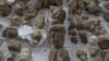 Pieces of statues damaged by the Taliban are laid out on a table for restoration at the National Museum in Kabul in October 2019.