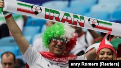 RUSSIA -- Iranian soccer fans cheer prior to the Russia 2018 World Cup Group B football match between Morocco and Iran at the St. Petersburg Stadium in St. Petersburg. June 15, 2018