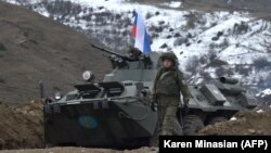 NAGORNO-KARABAKH -- Russian soldiers of the peacekeeping force man a checkpoint on a road outside Stepanakert, November 26, 2020