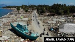Вызванные землетрясением и цунами разрушения на острове Сулавеси, Индонезия. 1 октября 2018 года.