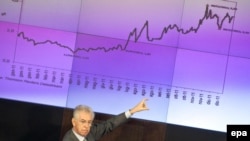 Italian Prime Minister Mario Monti pointed at a graph as he spoke during a year-ender news conference in Rome in December.