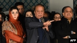 Former Pakistani Prime Minister Nawaz Sharif (center) addresses supporters on February 9. 