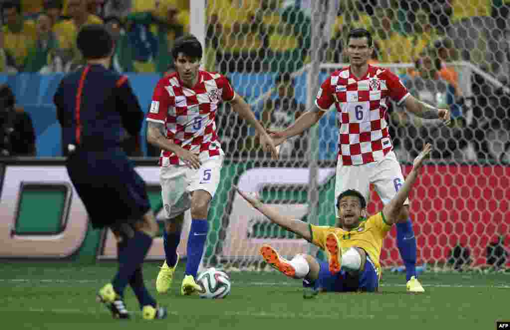 Brazil --Brazil's forward Fred (front) is fouled by Croatia's defender Dejan Lovren (R) to be awarded a penalty during a Group A football match between Brazil and Croatia at the Corinthians Arena in Sao Paulo during the 2014 FIFA World Cup, June 12, 2014