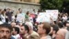 Georgia -- A participant reacts as policemen attempt to block protesters during a rally against the visit of the Russian delegation near the parliament building in Tbilisi, Georgia June 20, 2019