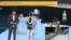A screen grab from a Rossia 24 news item that has come in for ridicule after failing to report that a robot at a high-tech career forum was nothing more than a man in costume. 