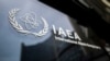 Teheran acuză de mult timp Agenția Internațională pentru Energia Atomică de părtinire și de colaborare cu puterile occidentale și cu Israelul împotriva Iranului.