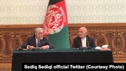 Afghan President Ashraf Ghani (R) and Abdullah Abdullah, his rival and former chief executive signed political agreement to end the election dispute on May 17.