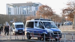 Police officers patrol an area near the Chancellery in Berlin on December 14 ahead of Ukraine peace talks.