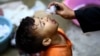 A health worker administers the polio vaccine to a child in Karachi. Pakistan and Afghanistan are the only two remaining countries in the world where polio is endemic. (file photo)