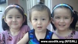 Ghozieva's other children: twin girls, Fotima and Zuhro, and son, Jamoliddin.