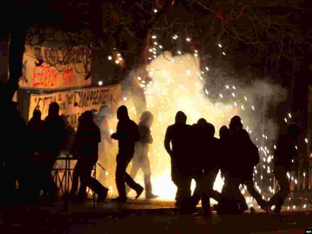 Greece wracked by protests. - Youngsters run to avoid tear gas thrown by riot police outside the Polytechnic University in Athens, Greece, on 10 December 2008. Clashes between students and police continued for a fifth straight day. Clearly the worst riots Greece has seen in recent years began within hours of the fatal shooting of a teenager on 06 December 2008 night in the bohemian district of Exarhia, in central Athens