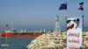 An Iranian oil tanker is seen floating on the Caspian Sea, as Iranian President Mohammad Khatami attends the opening ceremony 29 April 2004, of the Neka oil terminal on the Caspian Sea, 340 kms northwest of Tehran in Mazandaran province, a swap agreement 