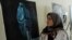 A visitor attends an exhibition in Herat to mark International Women's Day.