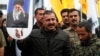 نیروهای حشد الشعبی در یک مراسم تشییع جنازه، فروردین ۱۴۰۵