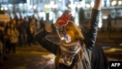 An antigovernment protester in front of a government building in Skopje.