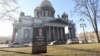 Declaring Putin 'Dead To Citizens Of Russia,' Activists Install Mock Gravestone In His Hometown