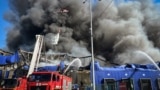 Firefighters work to extinguish a blaze following a Russian aerial strike in Kyiv on September 16. 