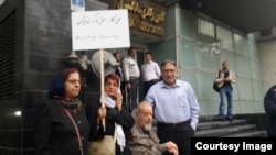 Nasrin Sotoudeh (holding sign) demonstrates in front of Iran's Bar Association in October.