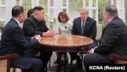 VIETNAM -- North Korean leader Kim Jong Un and U.S. President Donald Trump talk during the second North Korea-U.S. summit in Hanoi, February 28, 2019