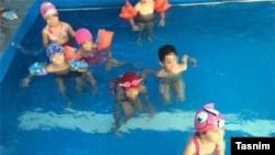 Photos like these, showing young girls and boys swimming together, resulted in a Tehran kindergarten being closed down. 