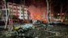 Destroyed cars are seen next to a residential building damaged during a Russian drone strike in Odesa, Ukraine, early on January 17.