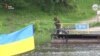Бойовики на переправі у Лобачевому на Луганщині вивісили прапор Осетії (відео)