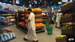 Customers are seen shopping at the al-Meera market in the Qatari capital Doha, on June 10, 2017.