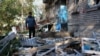 A man inspects the aftermath of a Russian attack on the Ukrainian city of Zaporizhzhya which occurred late on May 1. 