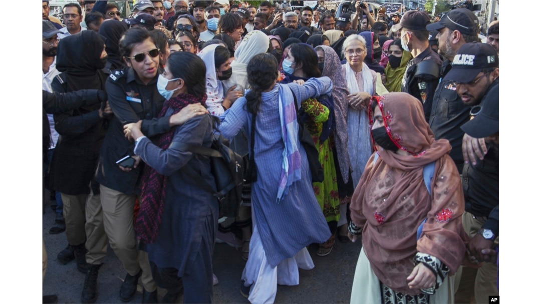 Police officers detain members of the BYC during a protest demanding Mahrang Baloch's release in Karachi, Pakistan, on March 24.