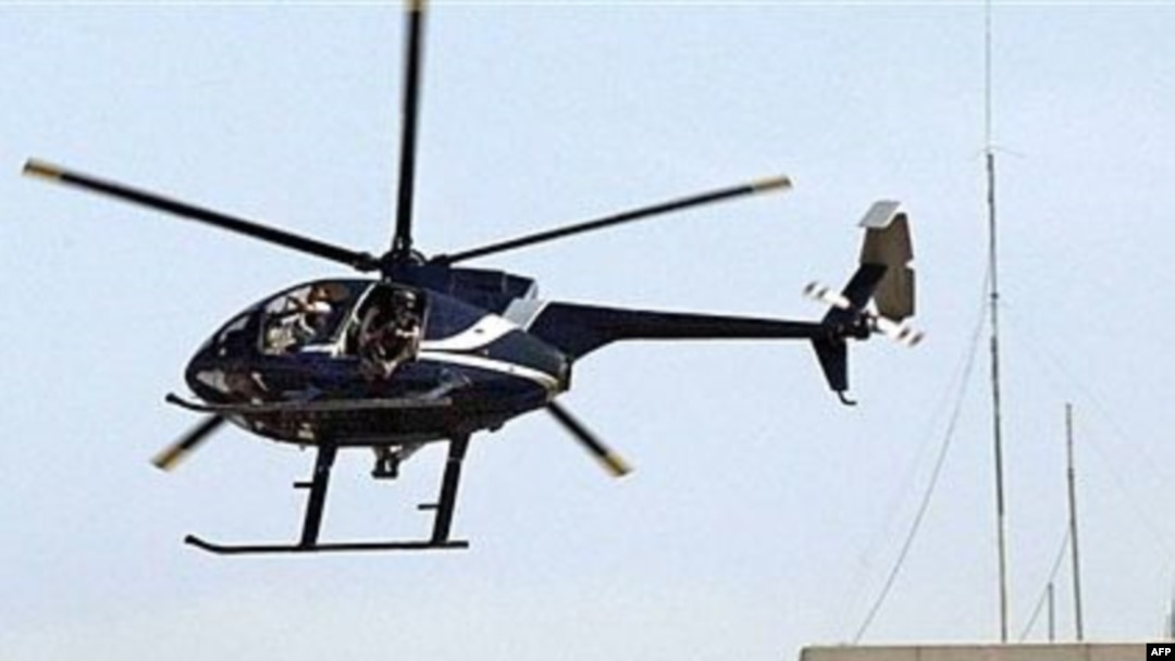 A private Blackwater helicopter flies over Baghdad