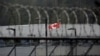 A Canadian flag flies outside of a Canadian correctional facility. File photo